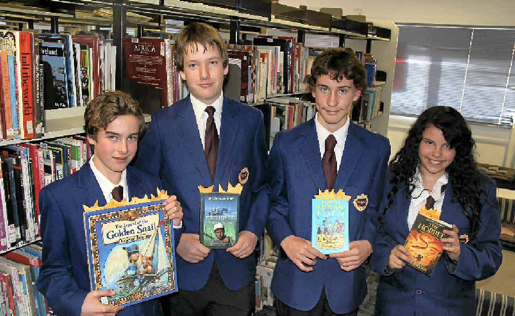 The students behind the Warwick State High School Readers Challenge with the books read by the primary school students (from let) Joe Greenaway, Brendan Austin, Jaron Clark and Aisling Pryor.